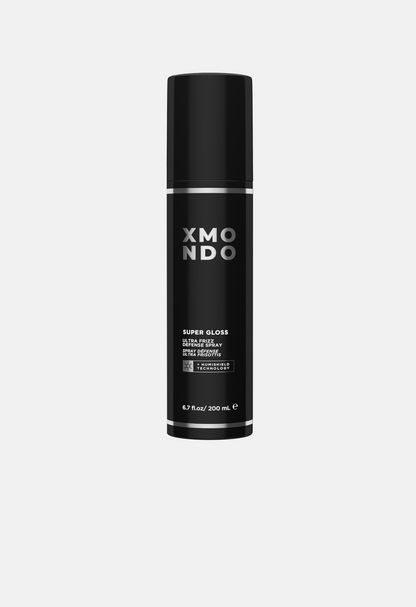 Black bottle of XMONDO hair product on a white background