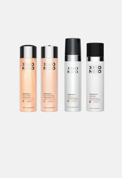 Four XMONDO haircare bottles on a white background